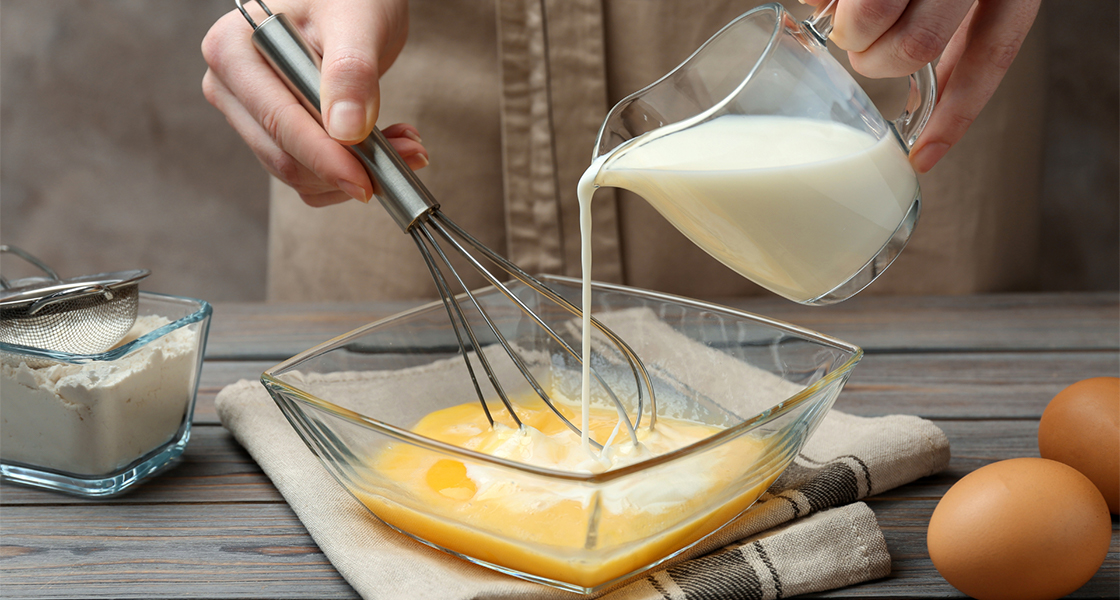 iwhisking milk and eggs together