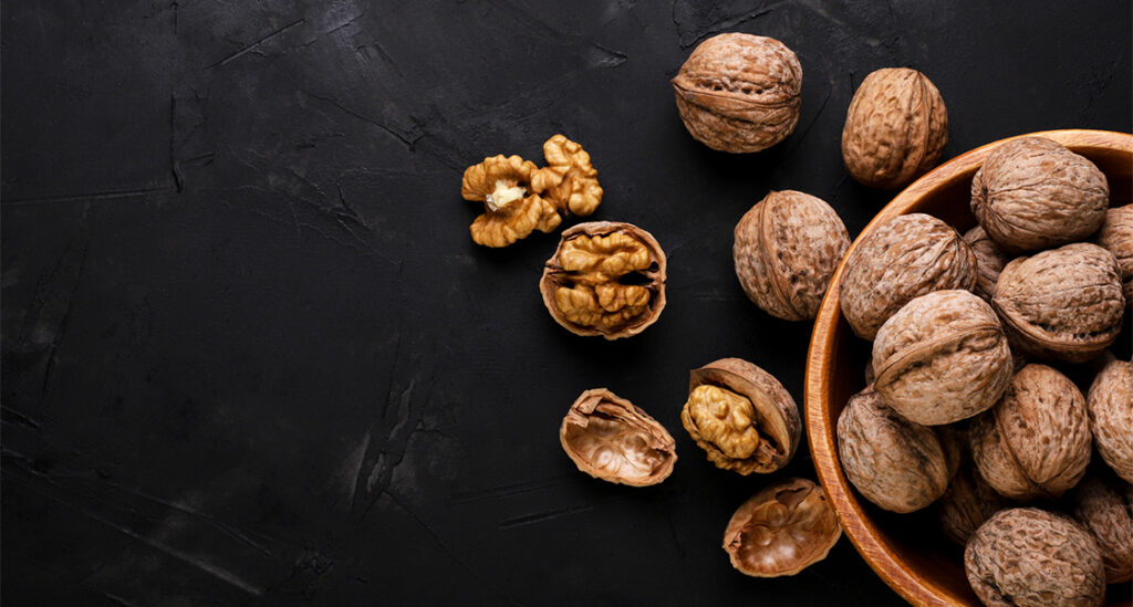 A bowl containing walnuts.