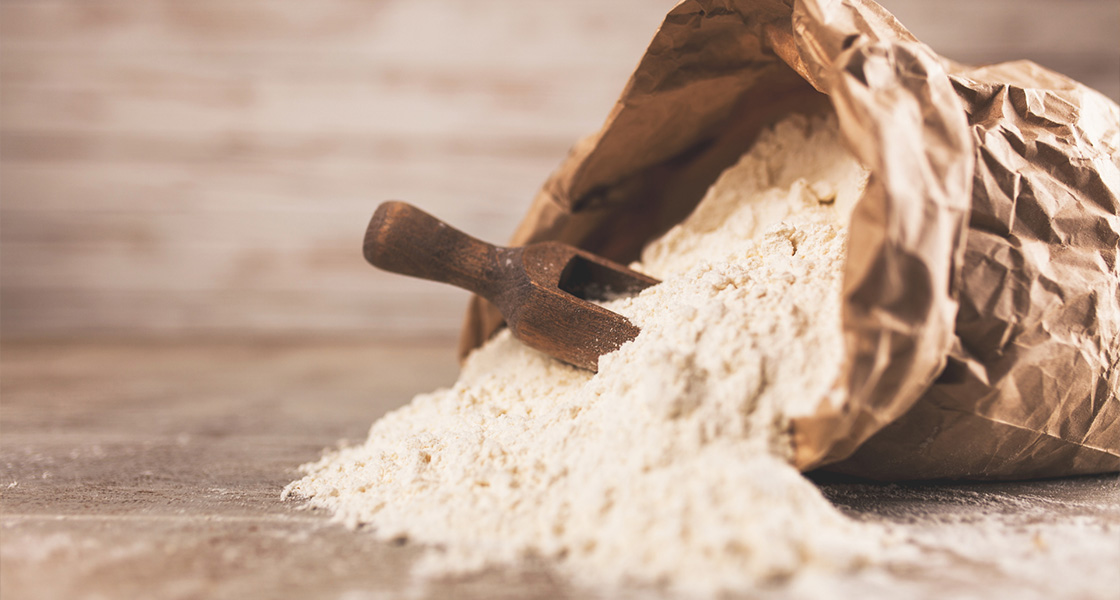 A bag of flour lying on a table